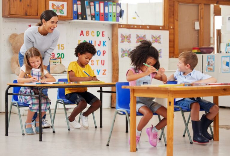 shot-of-a-young-woman-teaching-a-class-of-preschool-children